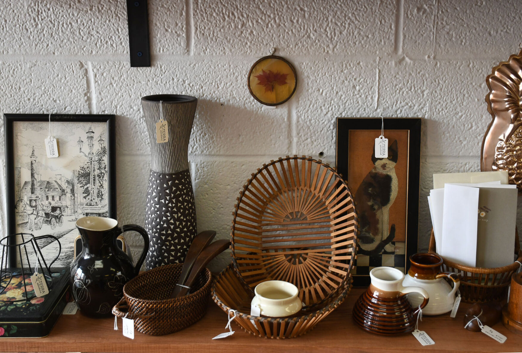 Various vintage and second hand items on a shelf